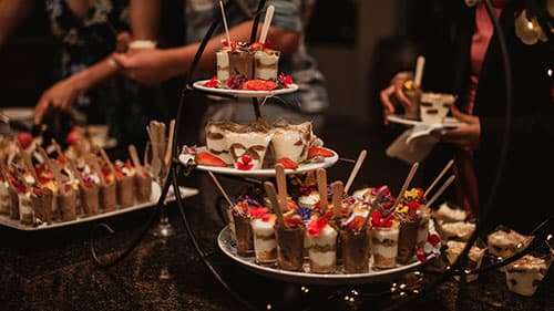 Guests enjoying a catered celebration by Tamleigh Catering