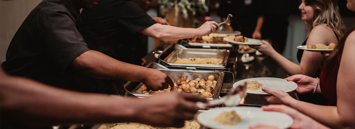 Tamleigh Catering team plating and serving food at an event